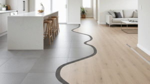 Obraz pokazujący otwartą przestrzeń mieszkalną, w której kuchnia i salon są połączone